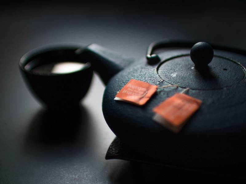 image of a kettle with green tea