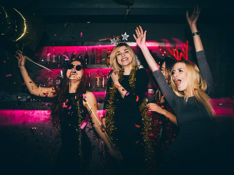 4 women having great fun in a nightclub