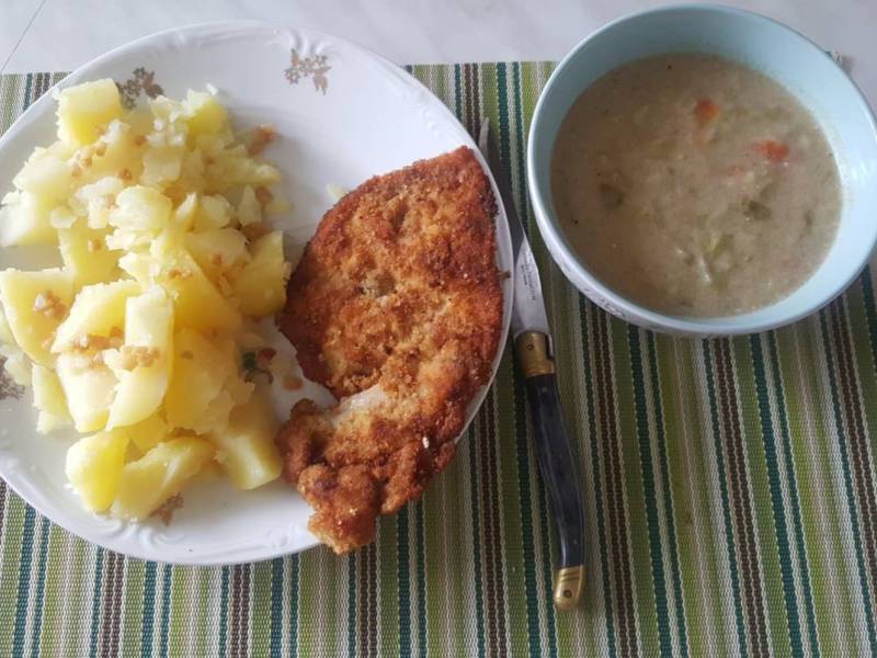 picture of schabowy served with potatoes and cabbage