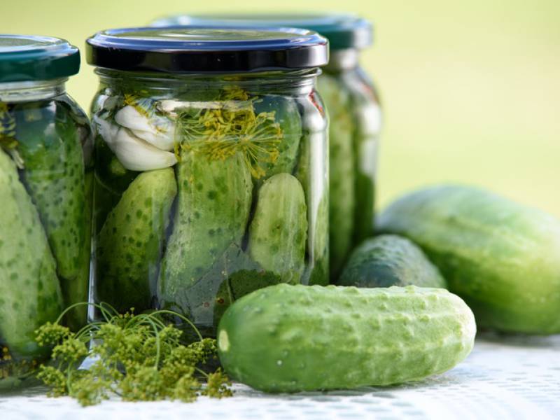 image of sour cucumbers in a jar